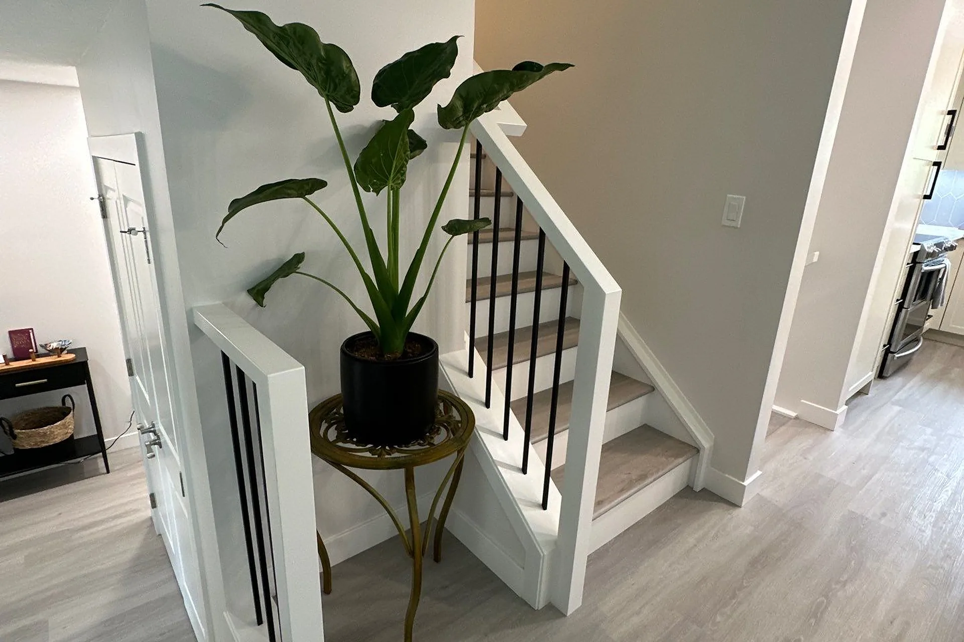 Freshly painted staircase and hallway walls in a Calgary home renovation by Upright Reno